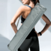 Yoga mat bag made from durable Oxford fabric with an adjustable strap for versatile carrying, perfect for yoga, Pilates, and fitness lovers.